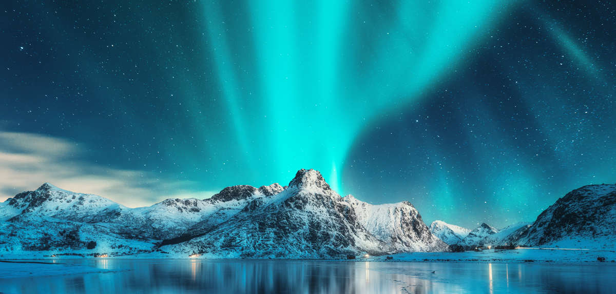 aurora-borealis-over-snowy-mountains-and-frozen.jpg