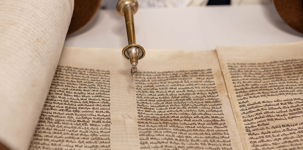 closeup-of-a-silver-yad-pointer-on-an-old-hebrew.jpg