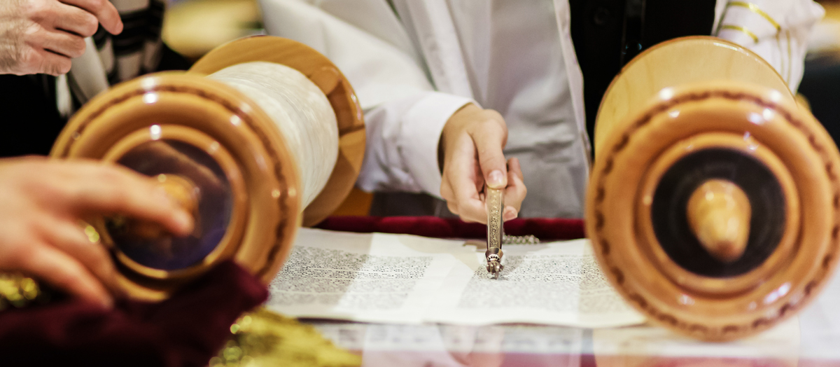 hand-of-boy-reading-the-jewish-torah-at-bar-mitzva.jpg